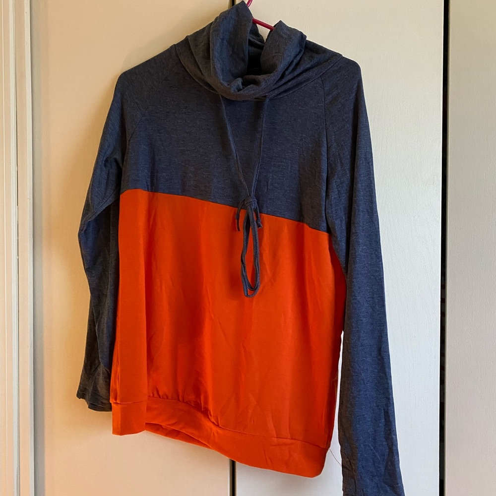 Blue and orange color block cowl neck shirt.